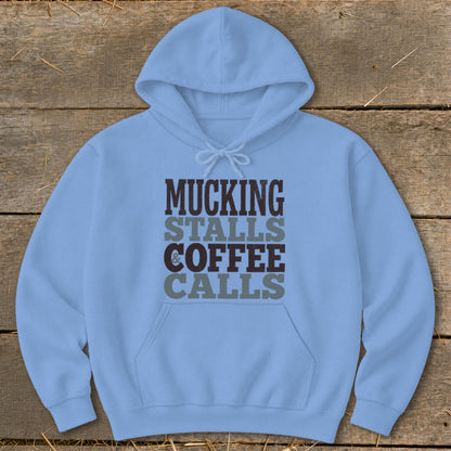 Light blue hoodie with "Mucking Stalls & Coffee Calls" text design.