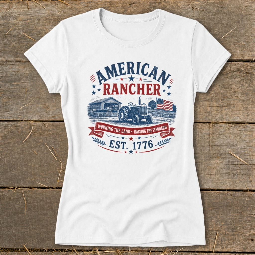 White t-shirt with American Rancher graphic featuring a tractor, barn, and flag.