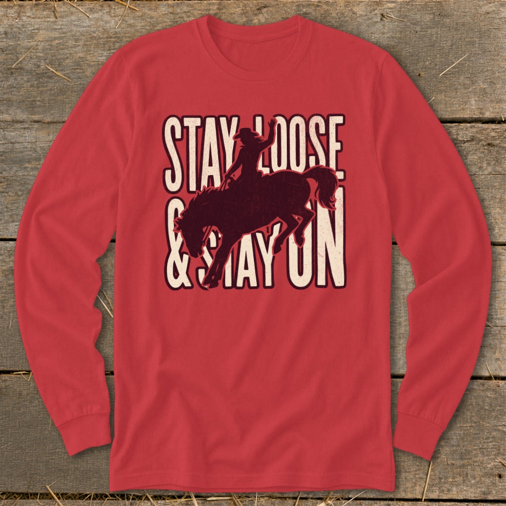 Red long-sleeved shirt with a rodeo rider silhouette and text.