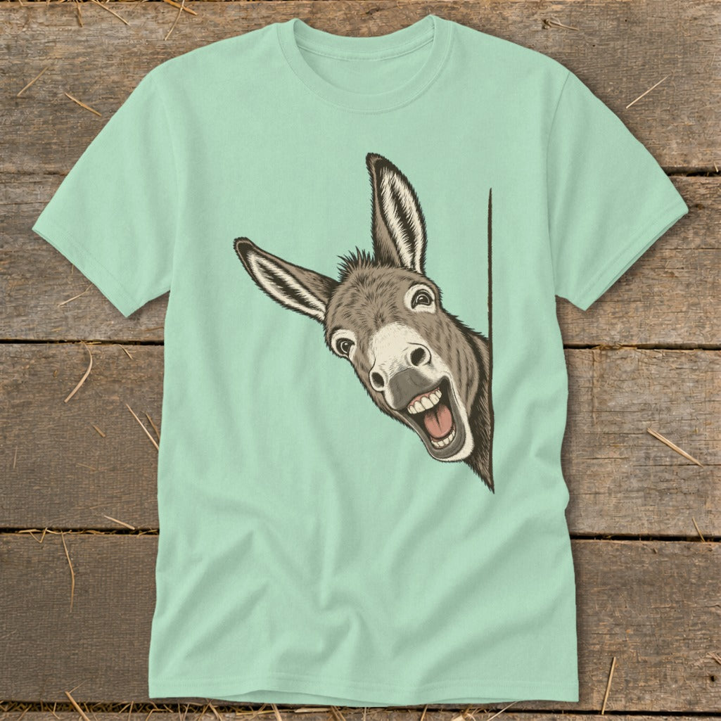 Light blue t-shirt with a cartoon donkey peeking around a corner with a wide smile.
