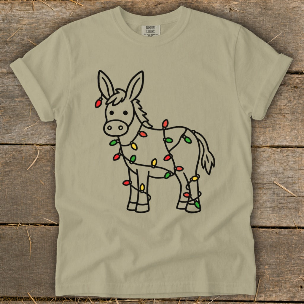 Donkey outline decorated with festive Christmas lights on a tan t-shirt.