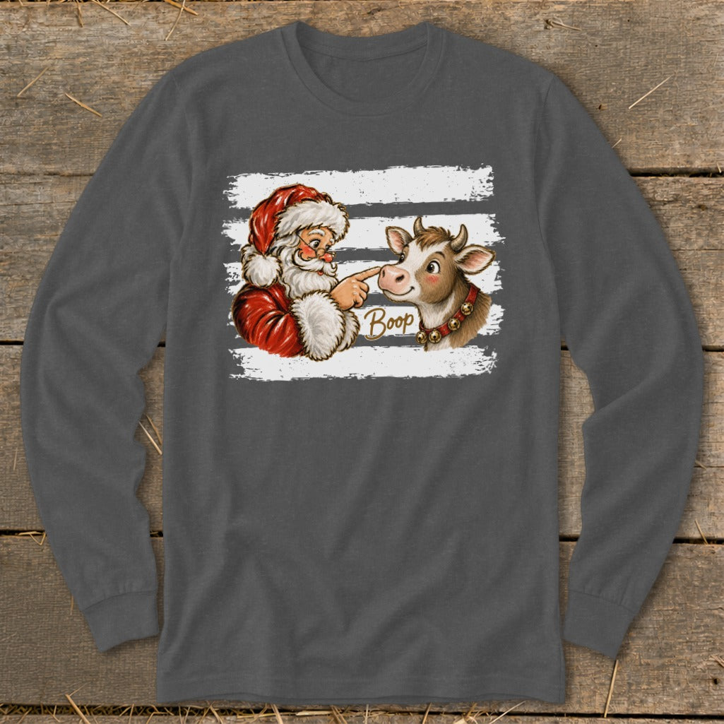 Santa boops a cow with the word "Boop" written on the shirt.