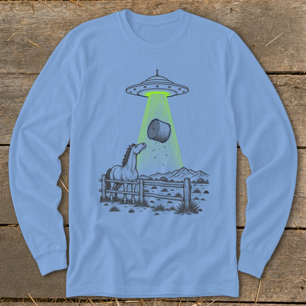 UFO abducting a hay bale with a horse watching behind a fence.