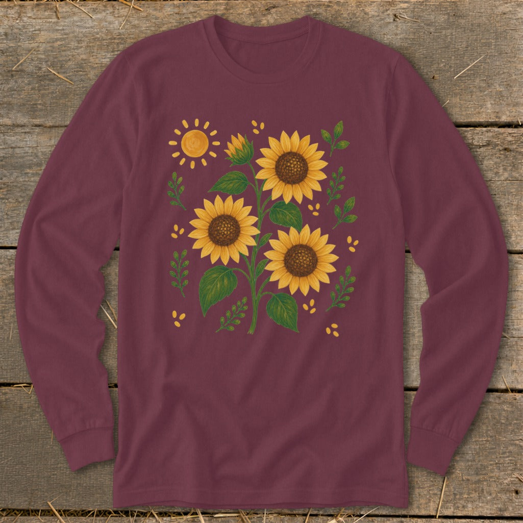 Maroon long-sleeved shirt with a watercolor sunflower and sun graphic.