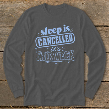 Dark gray long-sleeve shirt with blue text reading "sleep is CANCELLED it's FAIR WEEK".