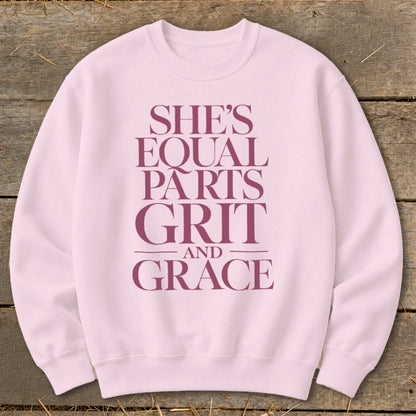 Pink sweatshirt with maroon text "She's Equal Parts Grit and Grace".