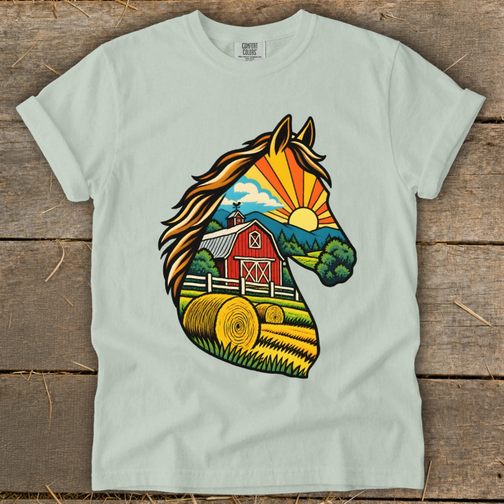Light green crewneck t-shirt featuring a horse head graphic filled with a farm landscape illustration.