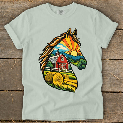 Light green crewneck t-shirt featuring a horse head graphic filled with a farm landscape illustration.
