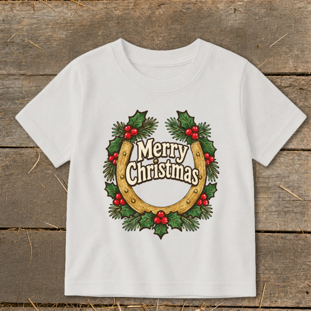White t-shirt with a horseshoe wreath and "Merry Christmas" text.