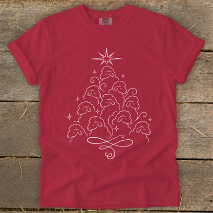 Red t-shirt with white line art of sheep forming a Christmas tree shape.