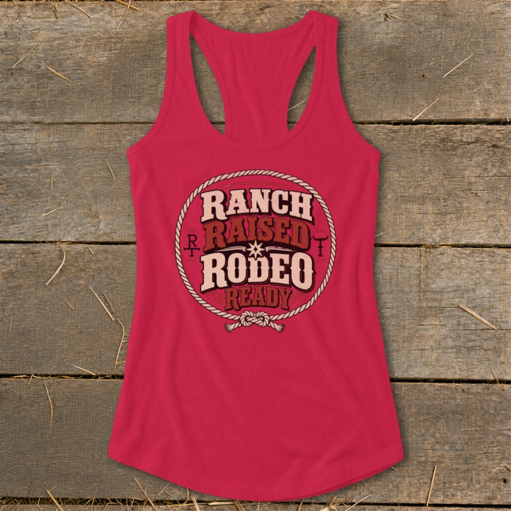 Pink tank top with "Ranch Raised Rodeo Ready" graphic inside a rope circle.
