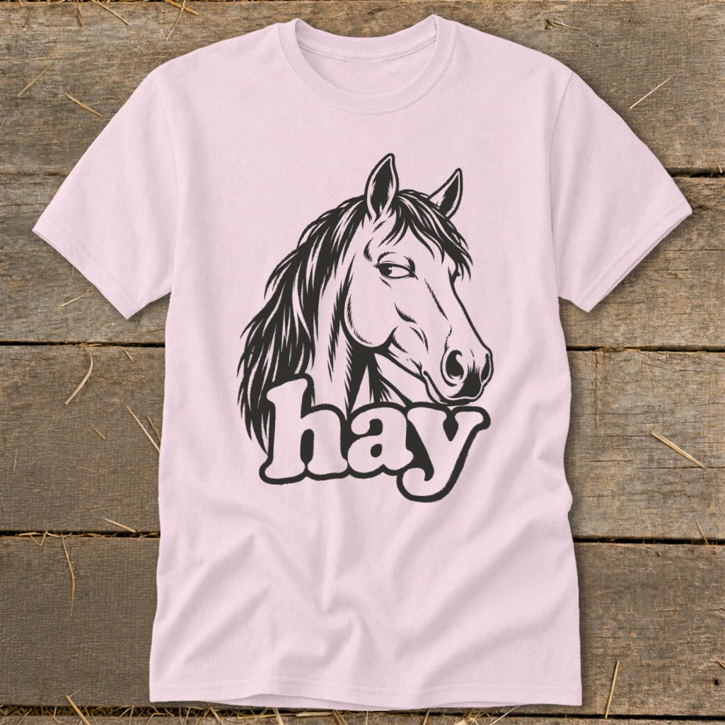 Pink t-shirt with black horse head graphic and the word "hay".