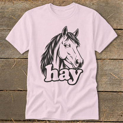 Pink t-shirt with black horse head graphic and the word "hay".