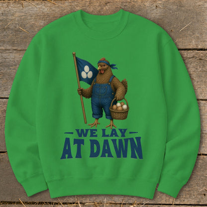 Chicken in overalls holding flag with three eggs and basket, "WE LAY AT DAWN" text.