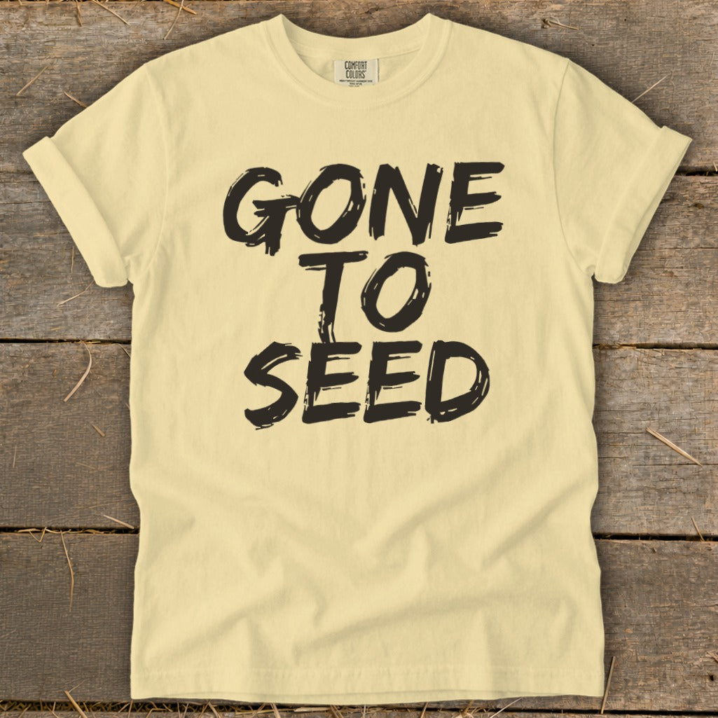 Pale yellow t-shirt with black text that reads "GONE TO SEED".