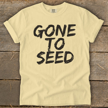 Pale yellow t-shirt with black text that reads "GONE TO SEED".