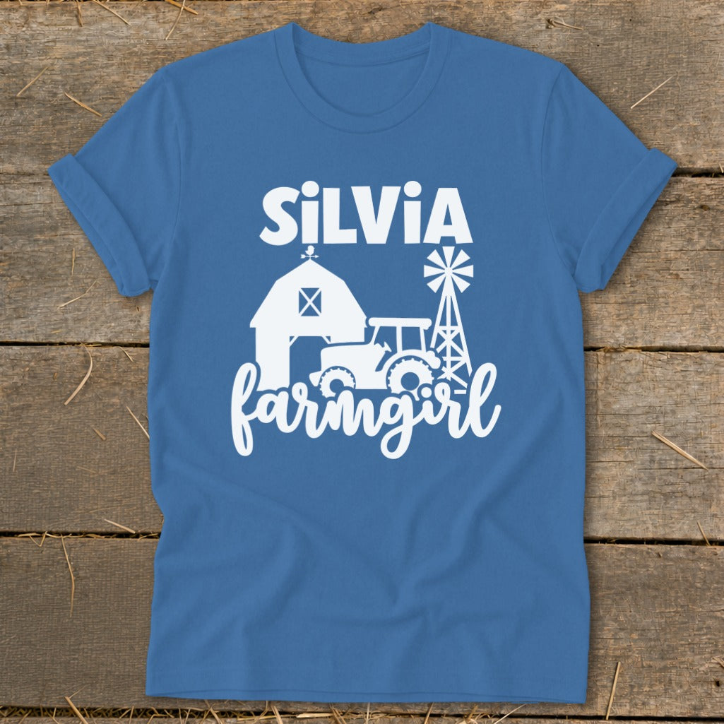 Blue t-shirt with "Silvia farmgirl" text, barn, tractor, and windmill graphics.