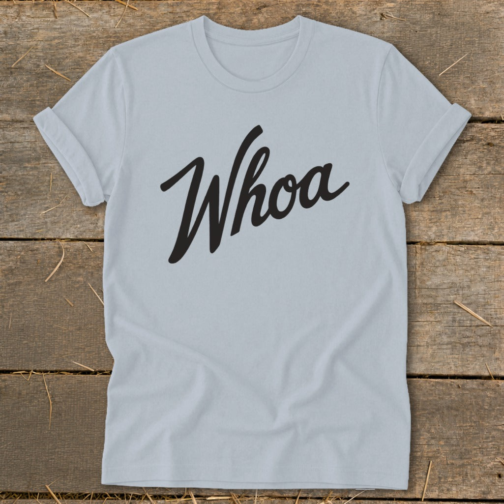 Light blue t-shirt with black cursive "Whoa" graphic.