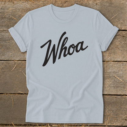 Light blue t-shirt with black cursive "Whoa" graphic.