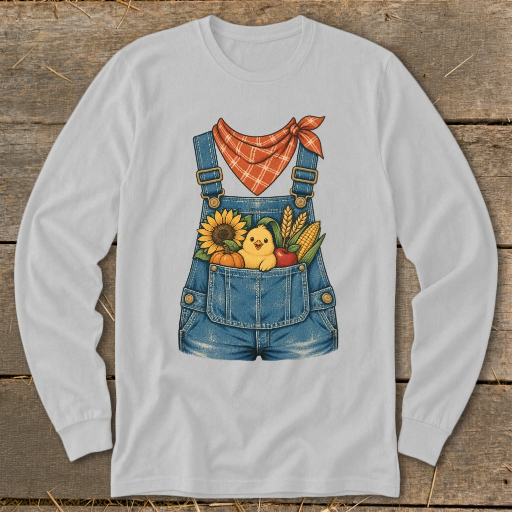 Overalls with a chick, sunflower, pumpkin, corn, and apple in the pocket.