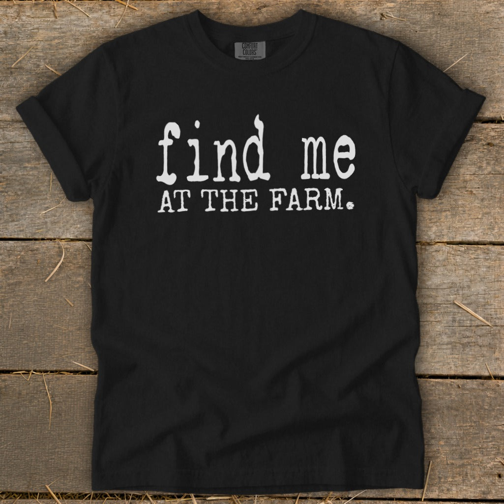 Black t-shirt with white text "find me AT THE FARM."