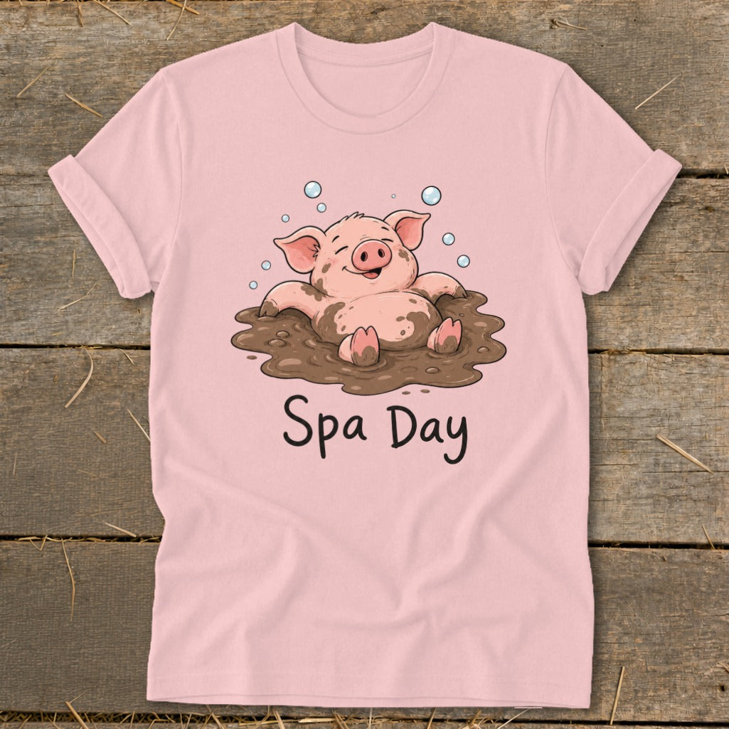 Pink t-shirt with cartoon pig enjoying a mud bath and text "Spa Day".