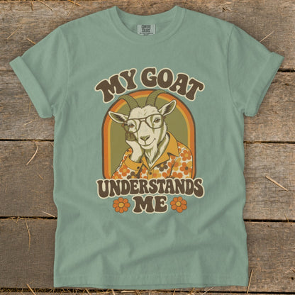 Goat wearing glasses and a floral shirt with text "My goat understands me".