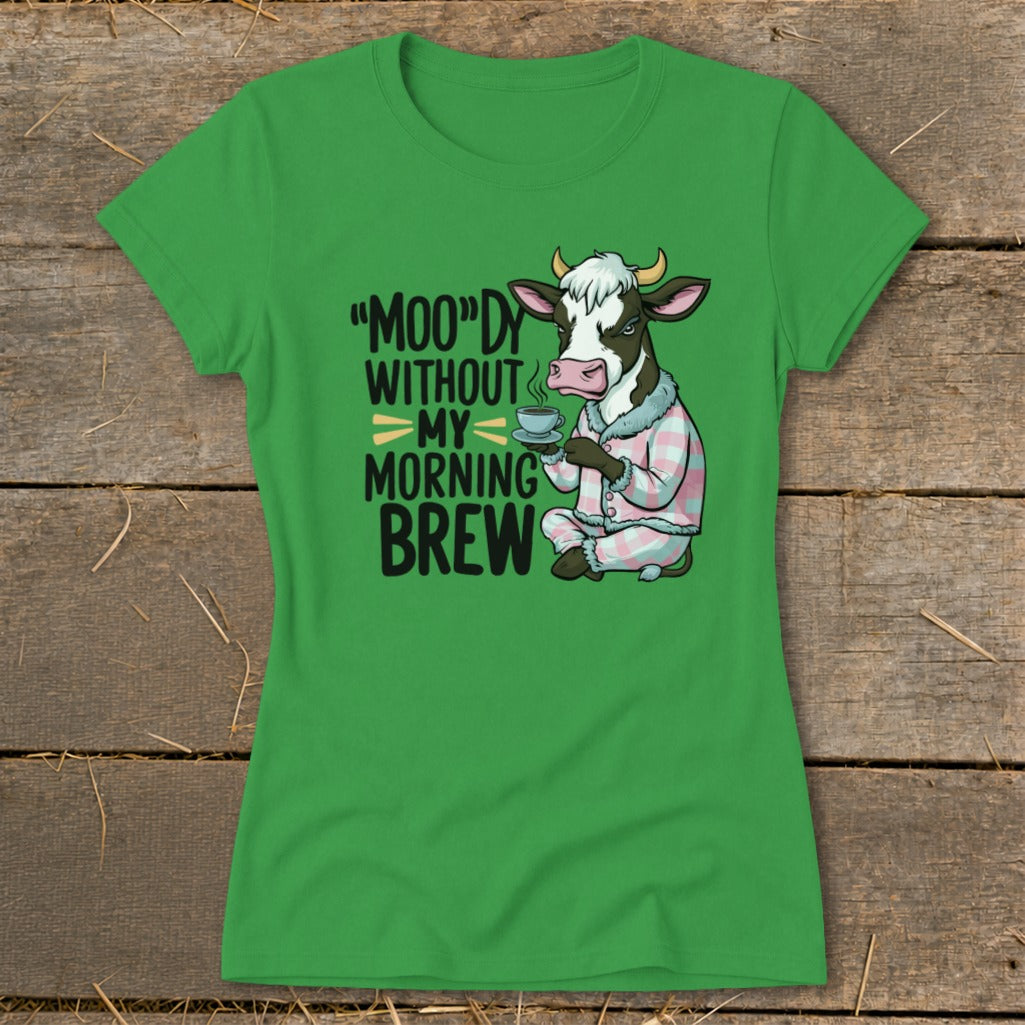 Green t-shirt with cow in pajamas holding coffee and text "Moo'dy Without My Morning Brew"