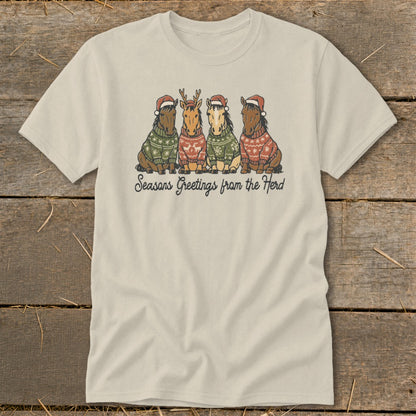Four horses wearing Santa hats and festive sweaters, with "Seasons Greetings from the Herd" text.
