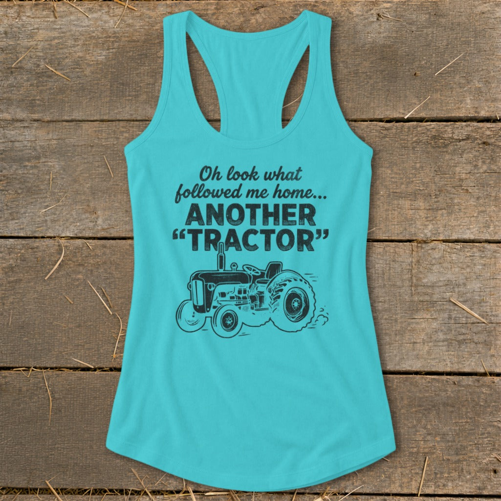 Turquoise tank top with black text and tractor graphic.