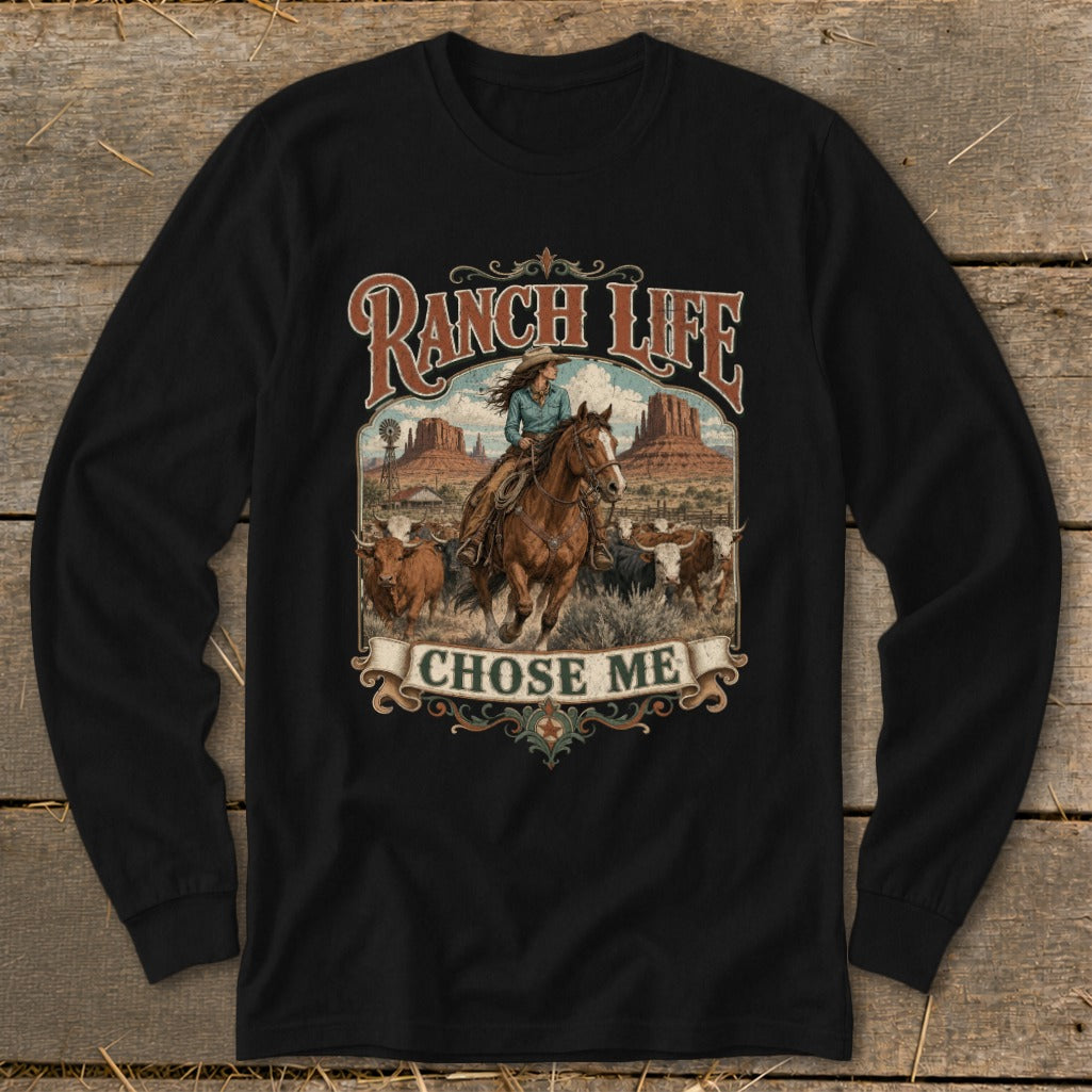 Black long-sleeve shirt with "Ranch Life Chose Me" graphic of woman riding horse among cattle.