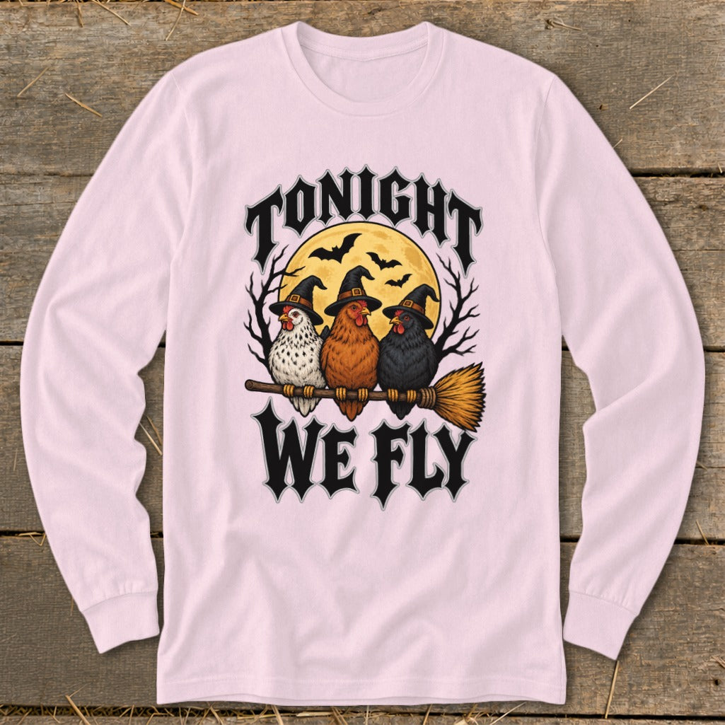 Three chickens wearing witch hats ride a broomstick under "Tonight We Fly."