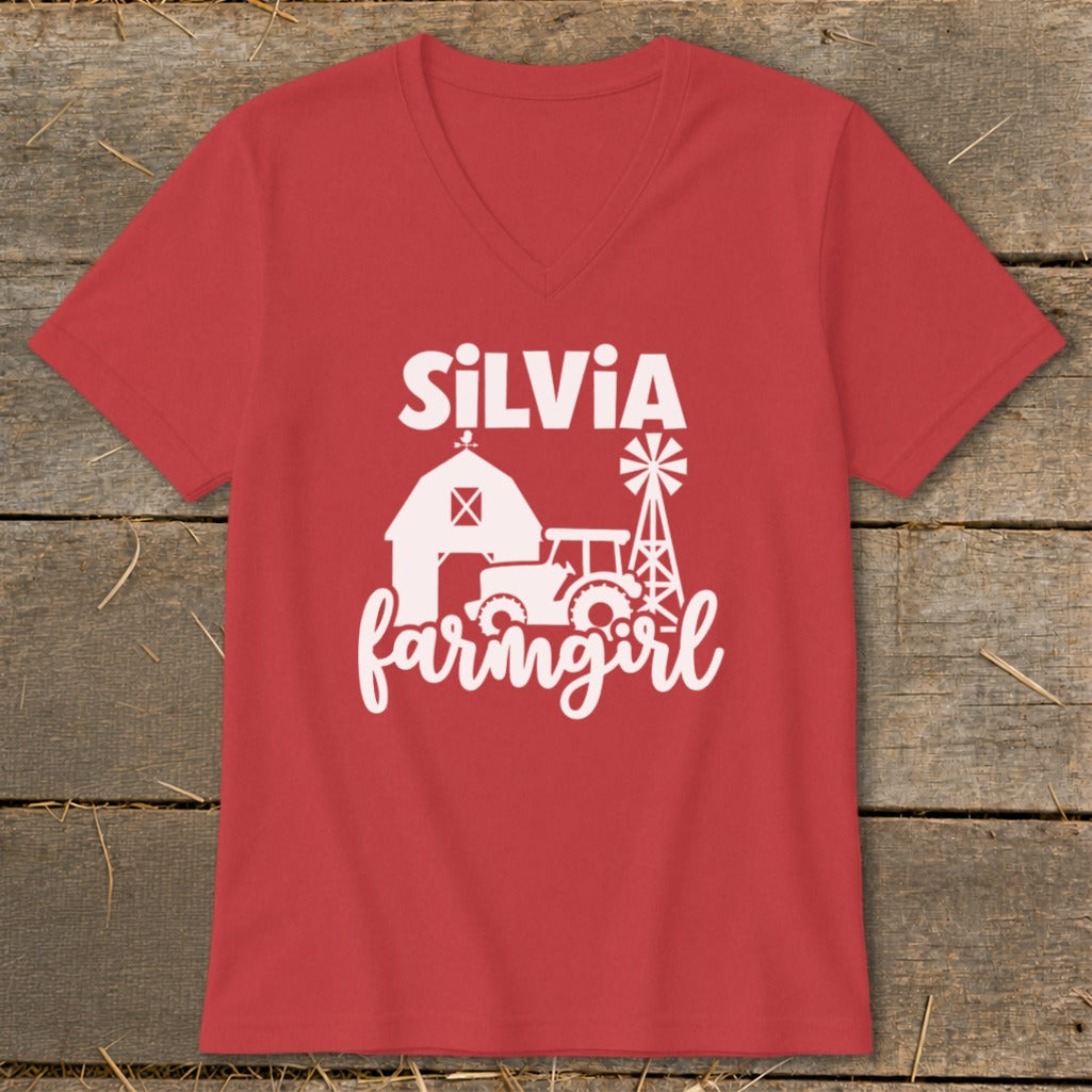 Red v-neck t-shirt with white "Silvia farmgirl" text and farm graphics.
