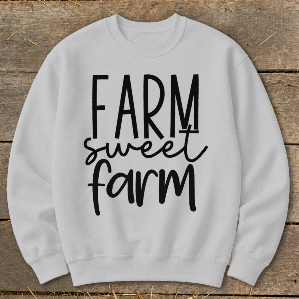 White sweatshirt with "FARM sweet farm" text in black lettering.