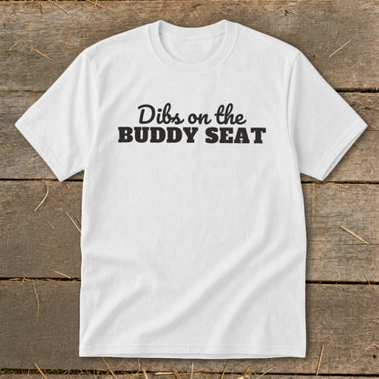 White t-shirt with black text that reads "Dibs on the BUDDY SEAT".