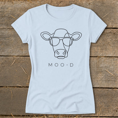 Light blue t-shirt with black line drawing of a cow wearing sunglasses and text "MOO-D".