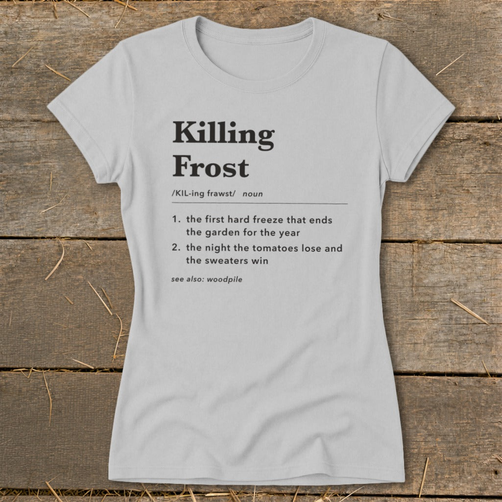 Light gray crewneck t-shirt featuring black dictionary definition text for Killing Frost on a rustic wooden background.