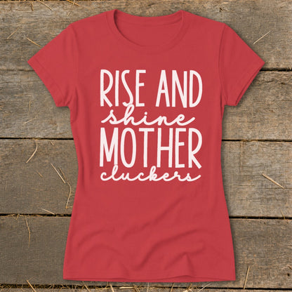 Red t-shirt with white text reading "Rise and shine mother cluckers".