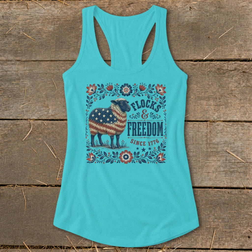 Teal tank top with a sheep wearing an American flag pattern. Text reads "Flocks & Freedom Since 1776".