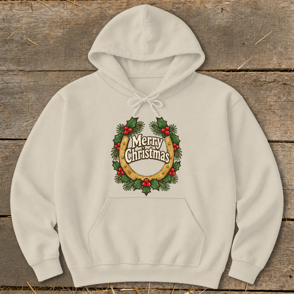 Cream hoodie with a horseshoe wreath graphic that reads "Merry Christmas".