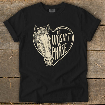 Black t-shirt with a horse head inside a heart that says "It Wasn't A Phase".