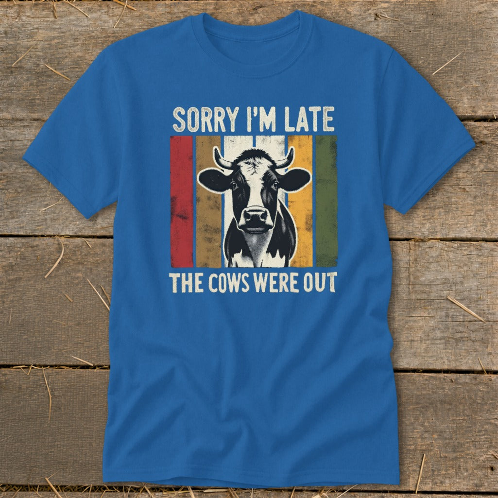 Blue t-shirt with black and white cow and text "Sorry I'm Late The Cows Were Out".