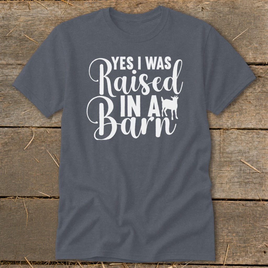 Dark gray t-shirt with white text "YES I WAS Raised IN A Barn" and a goat silhouette.
