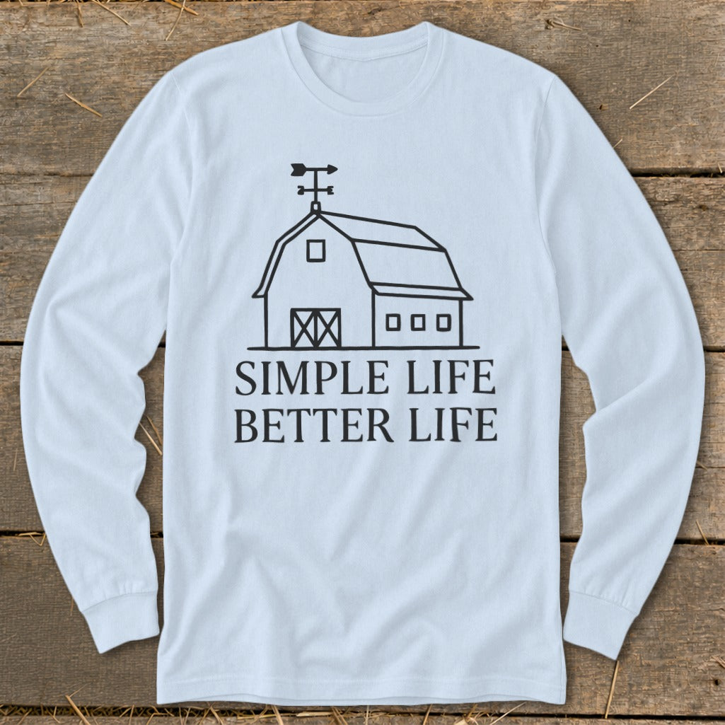 White long-sleeve shirt with a barn graphic and text "SIMPLE LIFE BETTER LIFE".