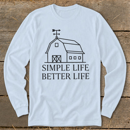 White long-sleeve shirt with a barn graphic and text "SIMPLE LIFE BETTER LIFE".