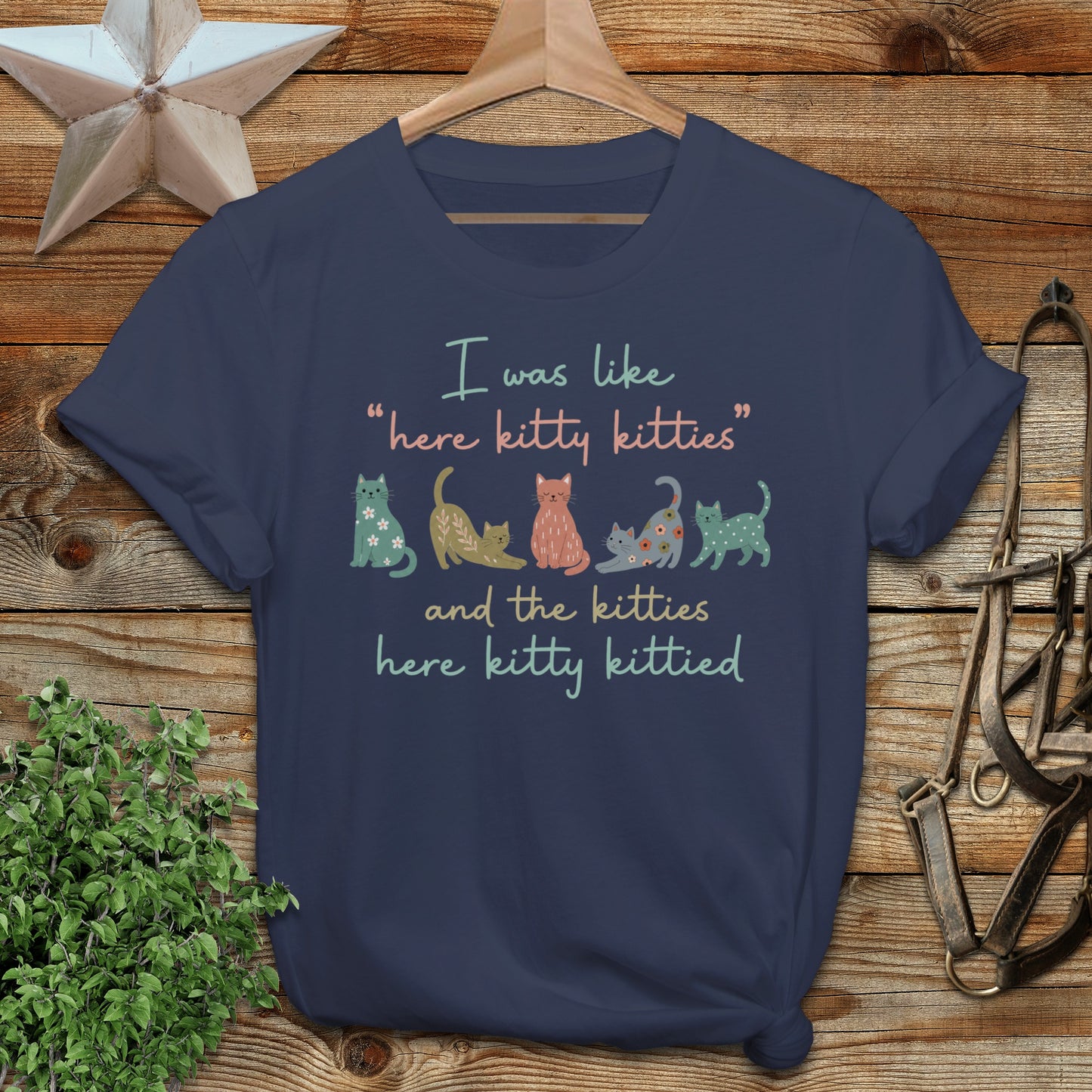 T-shirt with colorful cats and text "I was like 'here kitty kitties' and the kitties here kitty kittied".