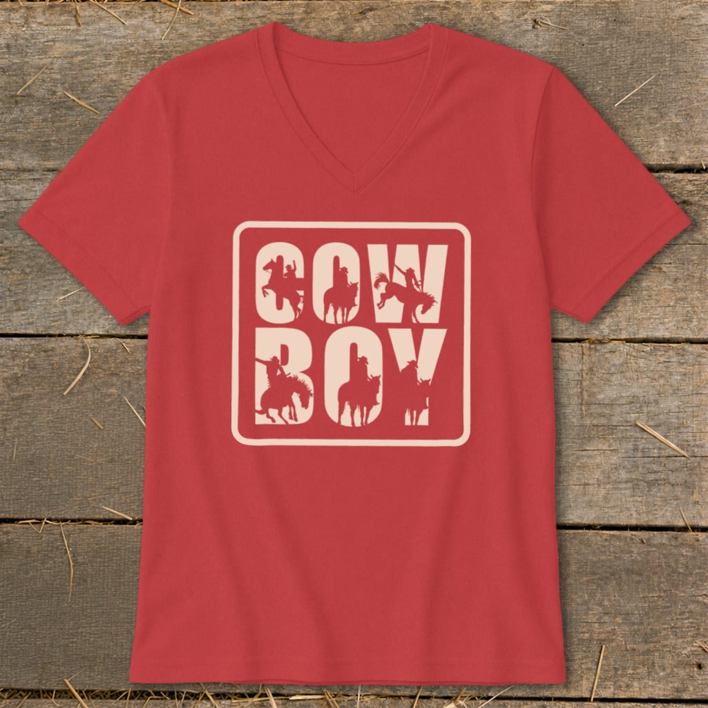 Red v-neck t-shirt with "COW BOY" text and cowboy silhouettes in a rectangular frame.