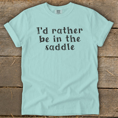 Light blue t-shirt with "I'd rather be in the saddle" text.