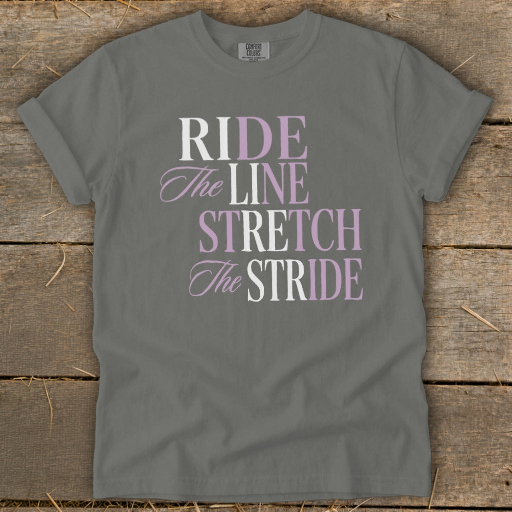 Gray t-shirt with text "RIDE The LINE STRETCH The STRIDE" in purple and white.
