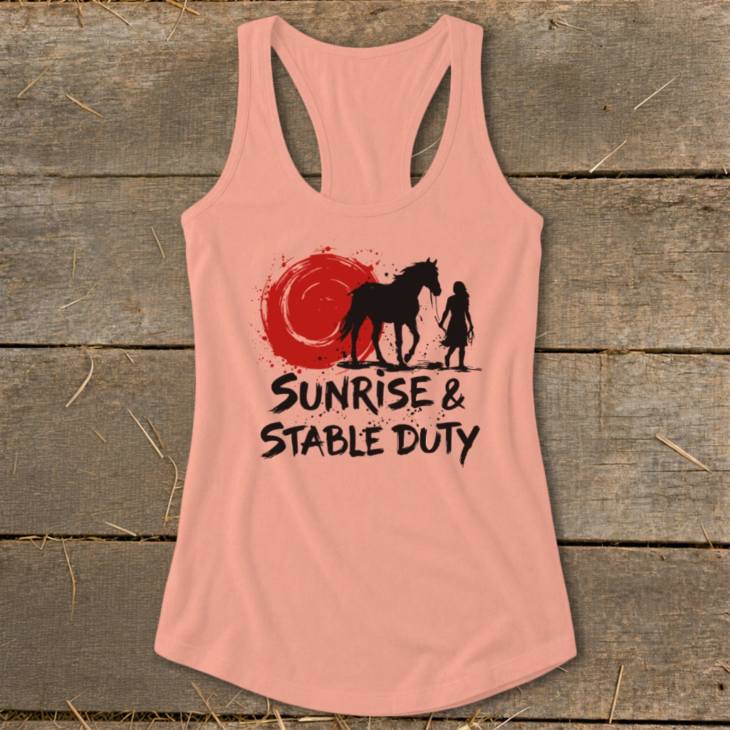 Pink tank top with sunrise, horse, and rider graphic and text "Sunrise & Stable Duty".